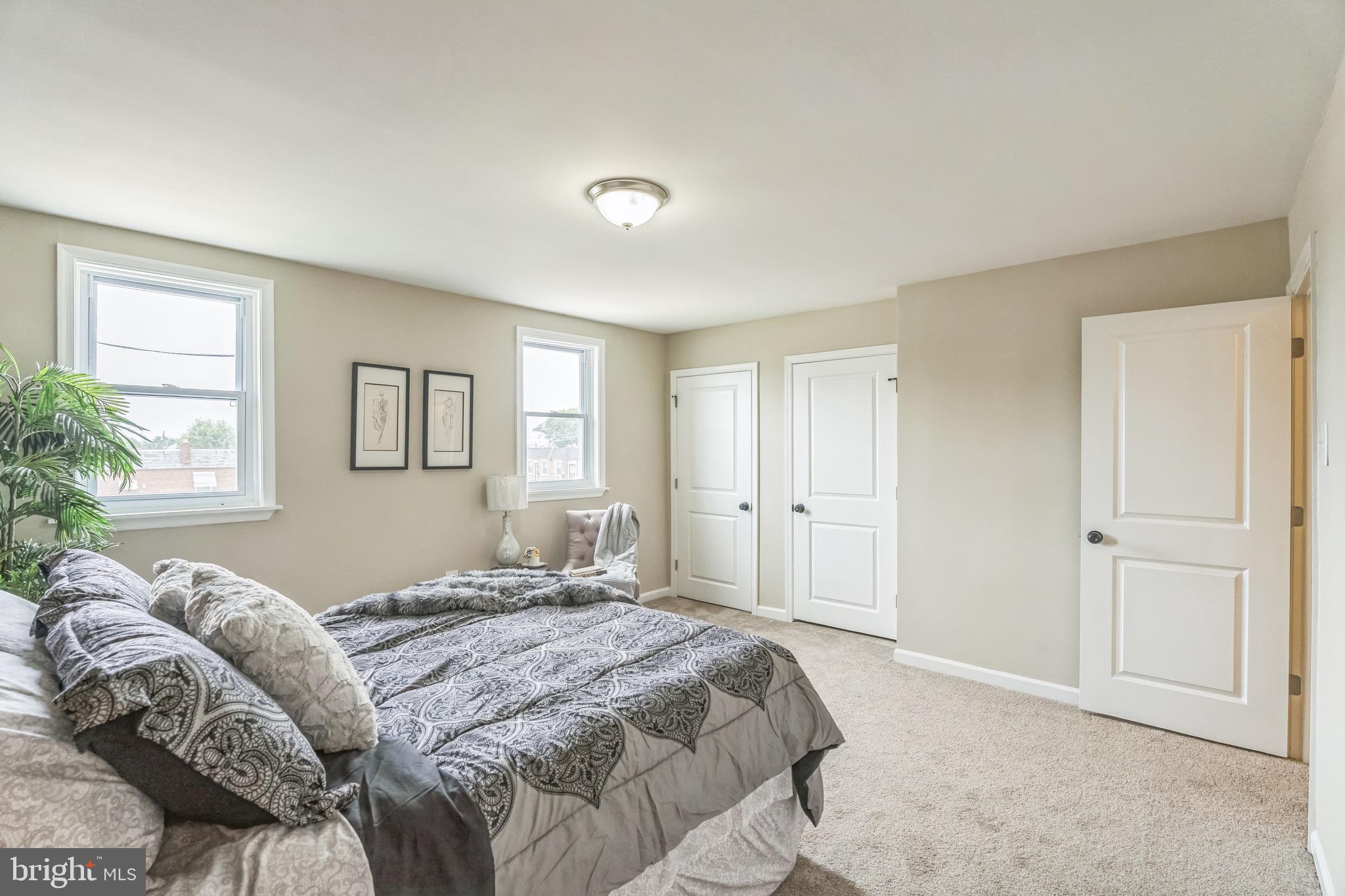 5734 Harbison Avenue Philadelphia, PA 19135 - Photo 14 of 29 a bedroom with a large bed and a window