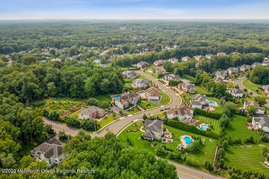 72 Edgewood Road Morganville, NJ 07751 - Photo 15 of 86 an aerial view of residential houses with outdoor space and trees