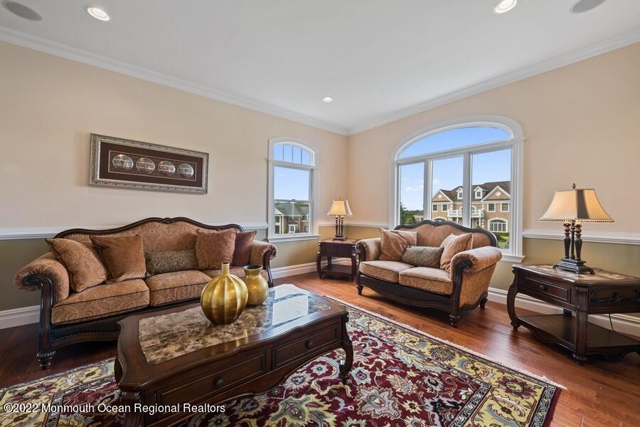 72 Edgewood Road Morganville, NJ 07751 - Photo 20 of 86 a living room with furniture a rug and a lamp