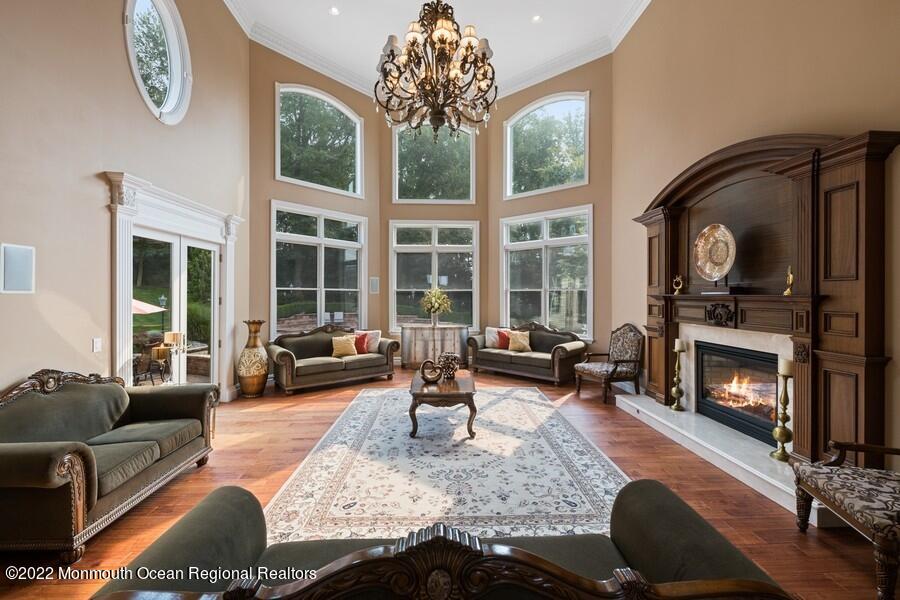 72 Edgewood Road Morganville, NJ 07751 - Photo 24 of 86 a living room with furniture and a fireplace