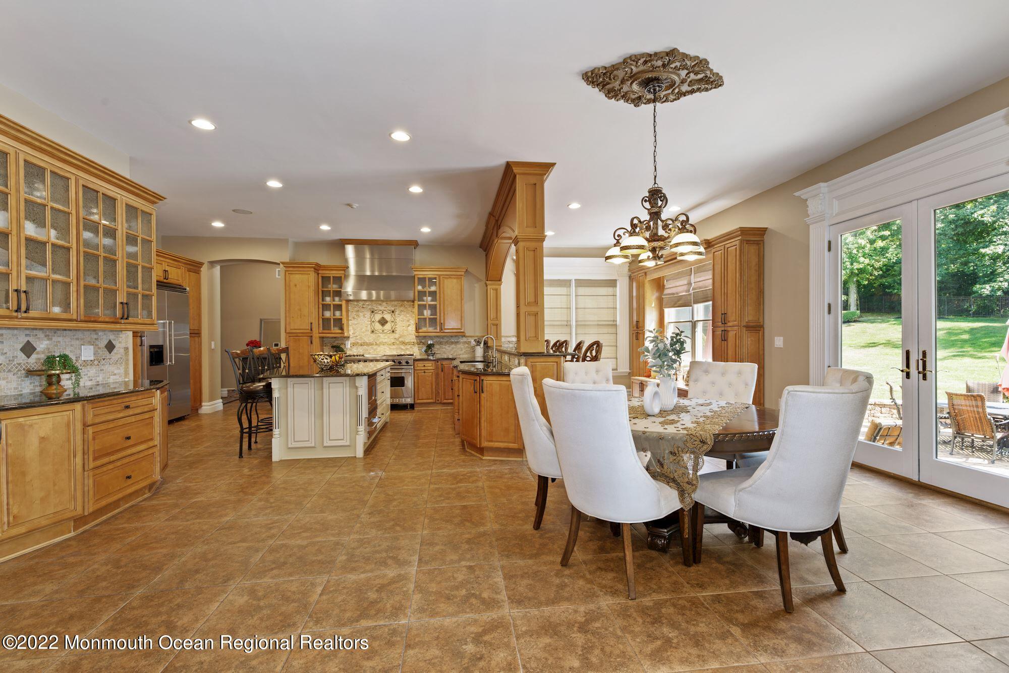 72 Edgewood Road Morganville, NJ 07751 - Photo 28 of 86 a view of a dining room with furniture and chandelier