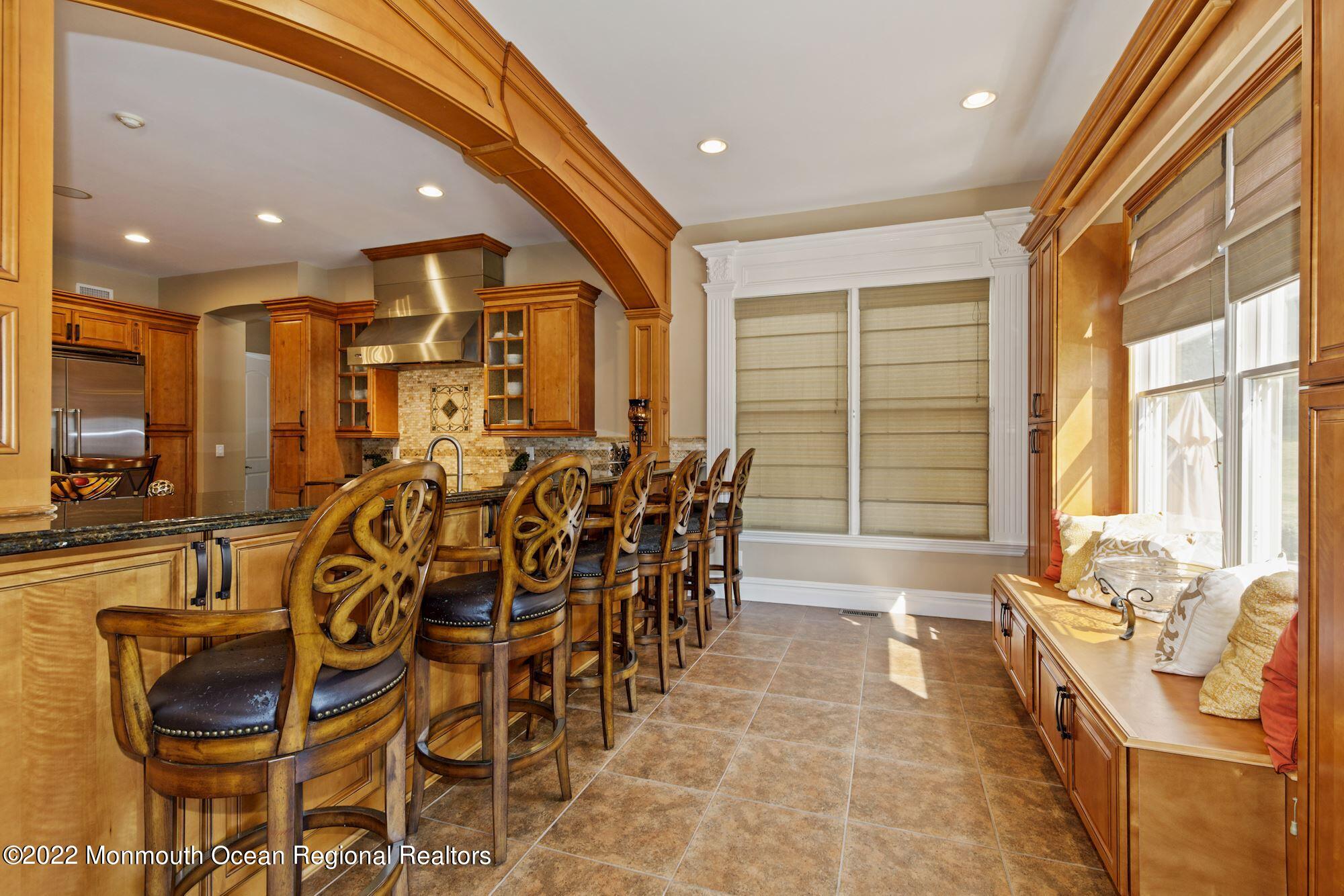 72 Edgewood Road Morganville, NJ 07751 - Photo 36 of 86 a very nice looking dining room with a large glass table and chairs