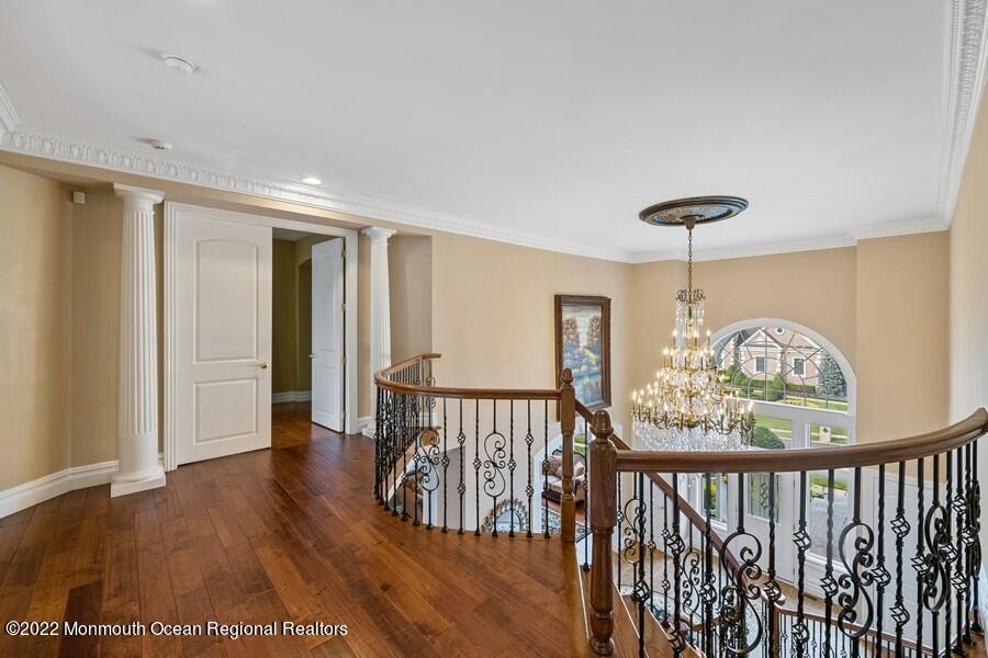 72 Edgewood Road Morganville, NJ 07751 - Photo 38 of 86 a view of a hallway with wooden floor and windows