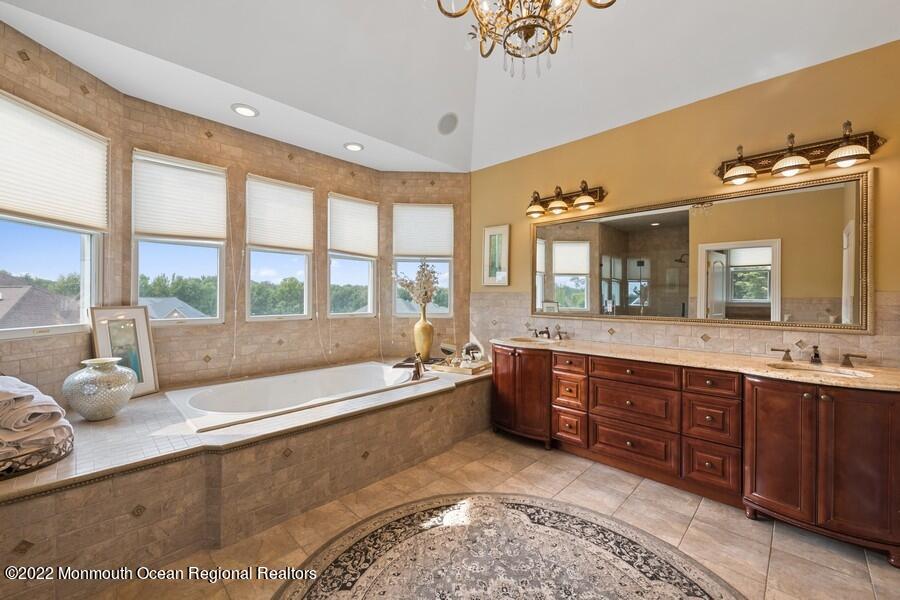 72 Edgewood Road Morganville, NJ 07751 - Photo 44 of 86 a large spacious bathroom with a large tub and sink