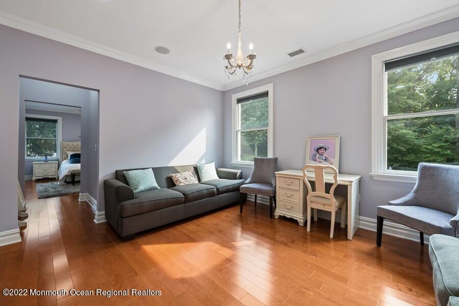 72 Edgewood Road Morganville, NJ 07751 - Photo 48 of 86 a living room with furniture and a large window