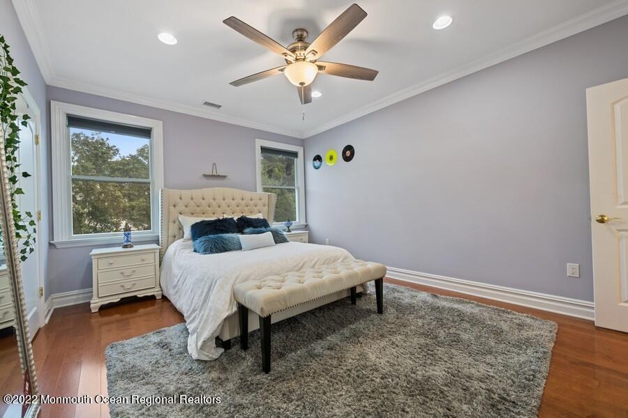 72 Edgewood Road Morganville, NJ 07751 - Photo 49 of 86 a bedroom with a bed and a large window with outer view