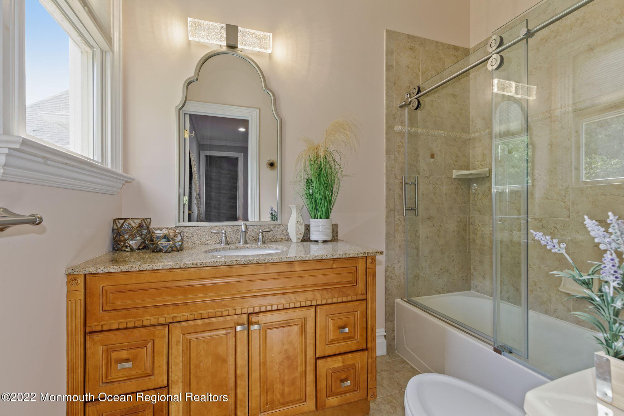 72 Edgewood Road Morganville, NJ 07751 - Photo 50 of 86 a bathroom with a sink a toilet and shower