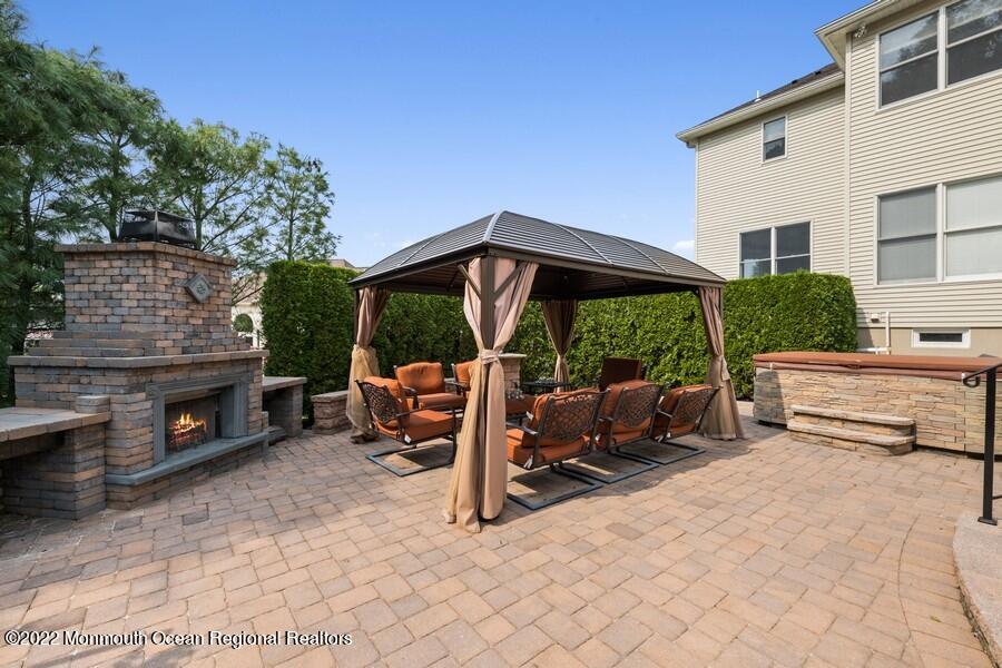72 Edgewood Road Morganville, NJ 07751 - Photo 65 of 86 a view of a patio with a table and chairs