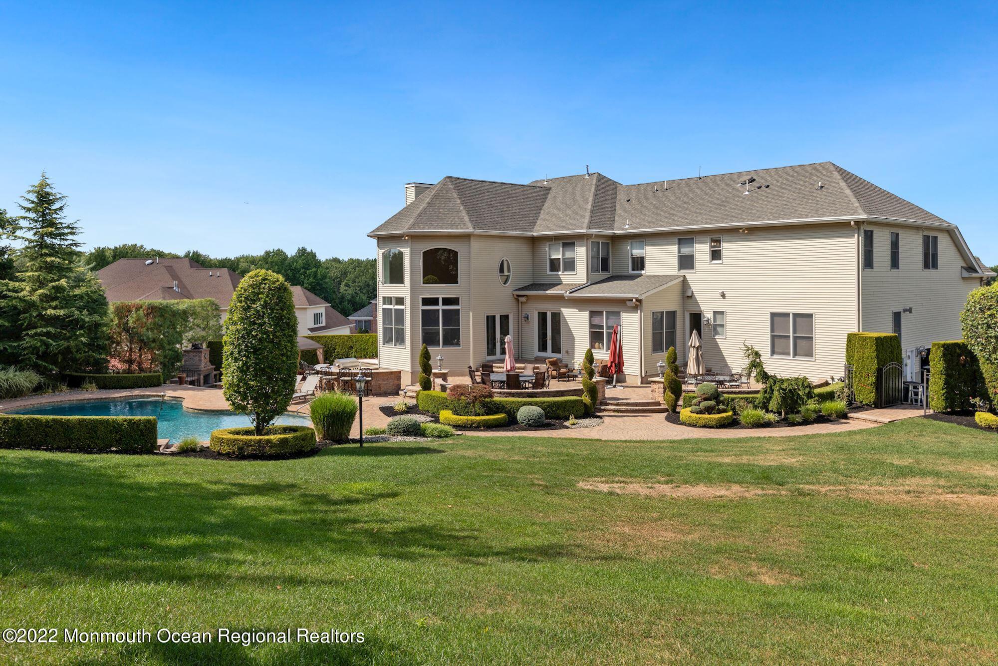 72 Edgewood Road Morganville, NJ 07751 - Photo 69 of 86 a view of a house with sitting area and garden
