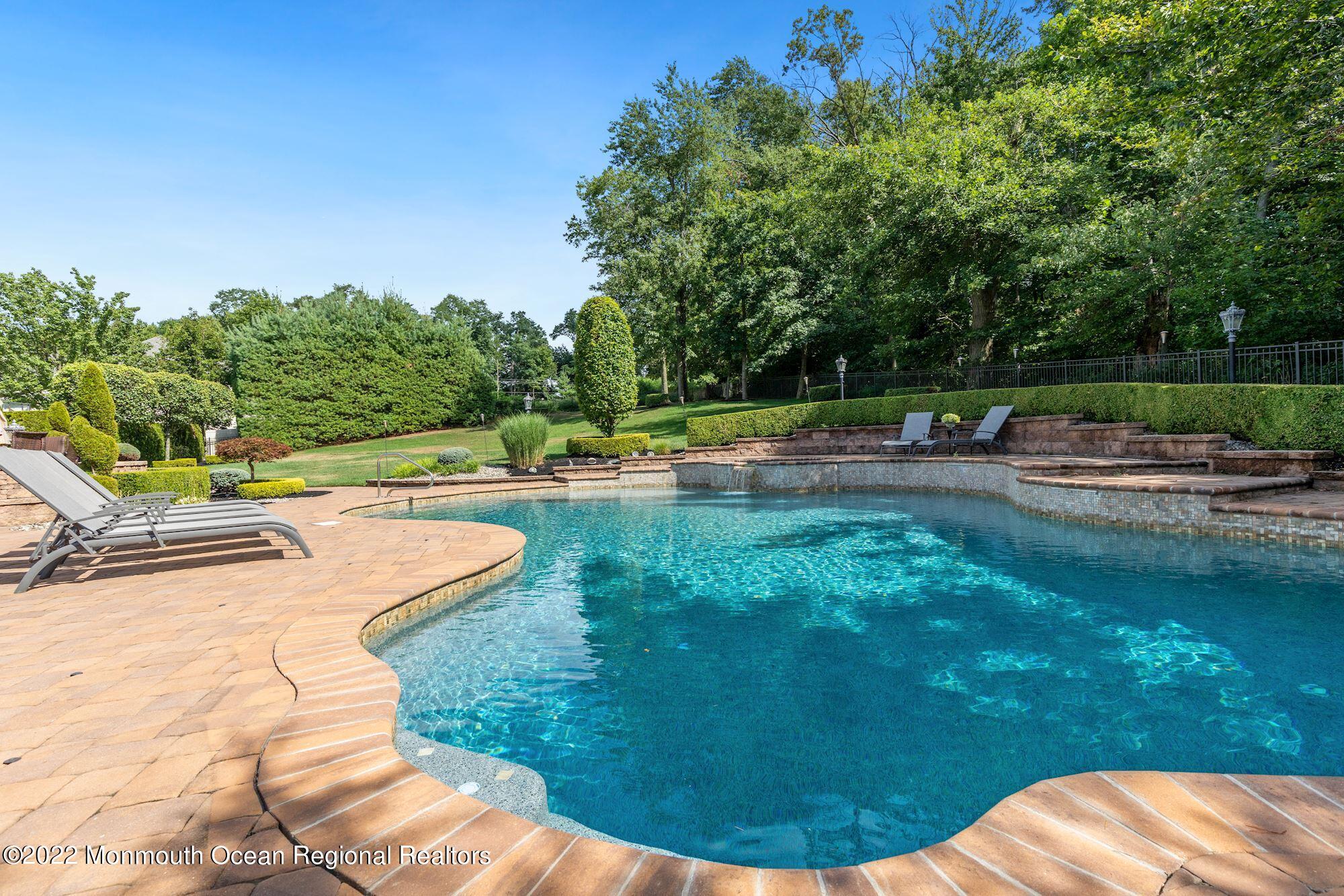 72 Edgewood Road Morganville, NJ 07751 - Photo 71 of 86 a view of a swimming pool with a yard