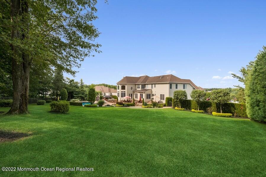 72 Edgewood Road Morganville, NJ 07751 - Photo 72 of 86 a view of a house with a big yard