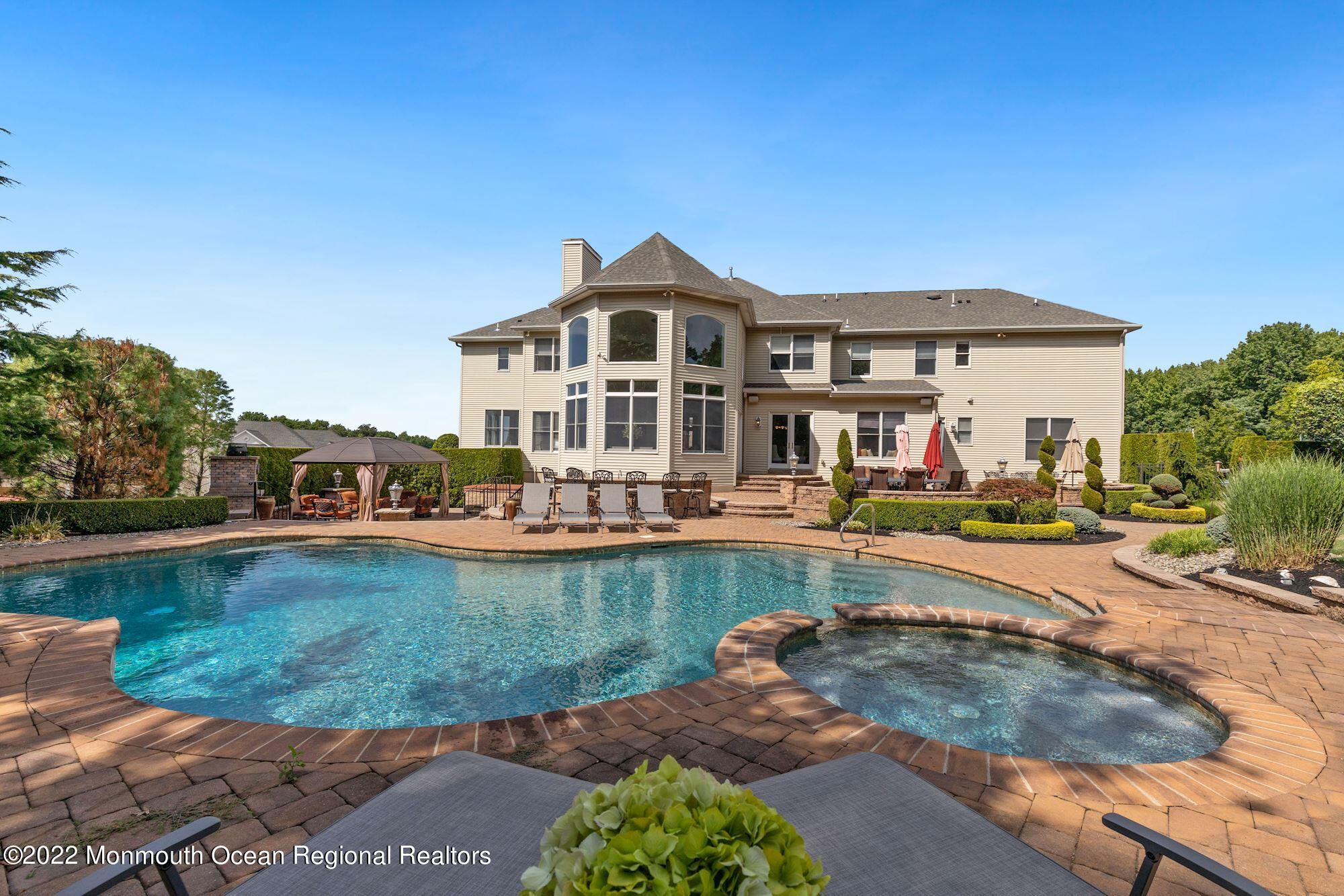 72 Edgewood Road Morganville, NJ 07751 - Photo 78 of 86 a view of a house with swimming pool