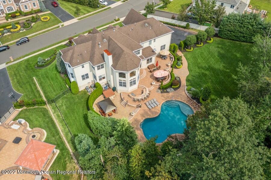 72 Edgewood Road Morganville, NJ 07751 - Photo 10 of 86 an aerial view of a house with outdoor space and a lake view