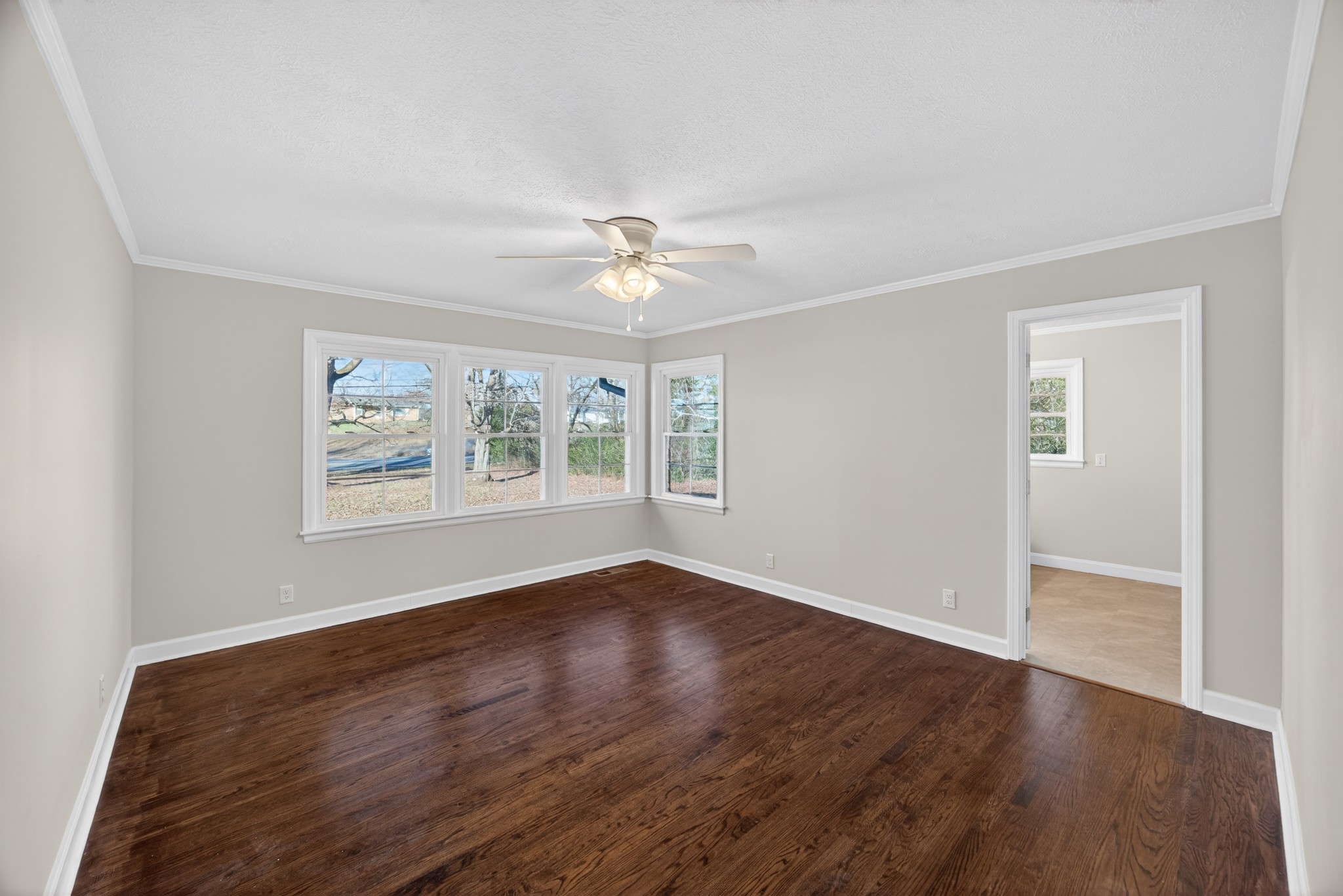 2136 West Broad Street Cookeville, TN 38501 - Photo 13 of 33 an empty room with wooden floor and windows