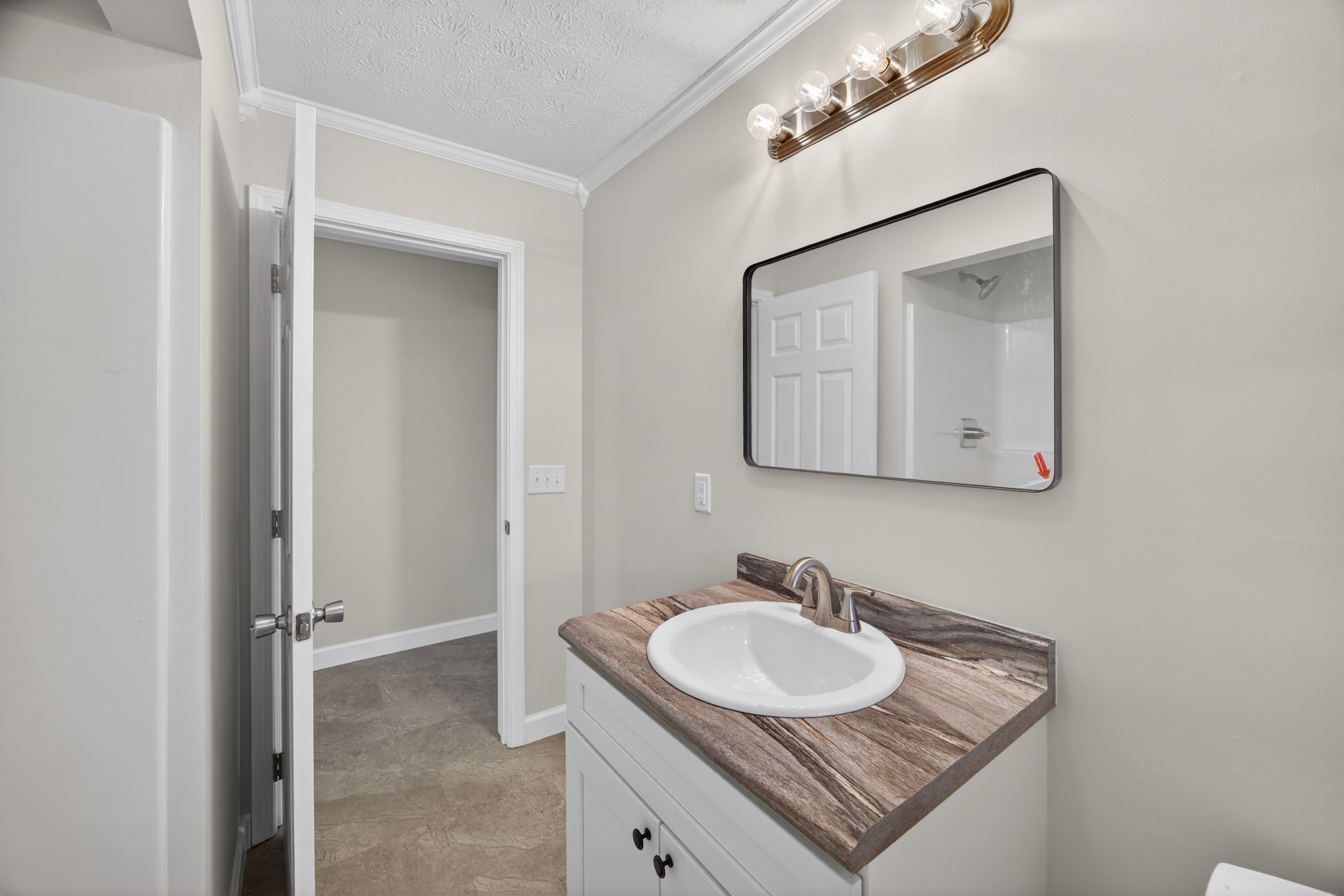 2136 West Broad Street Cookeville, TN 38501 - Photo 20 of 33 a bathroom with a sink and a mirror
