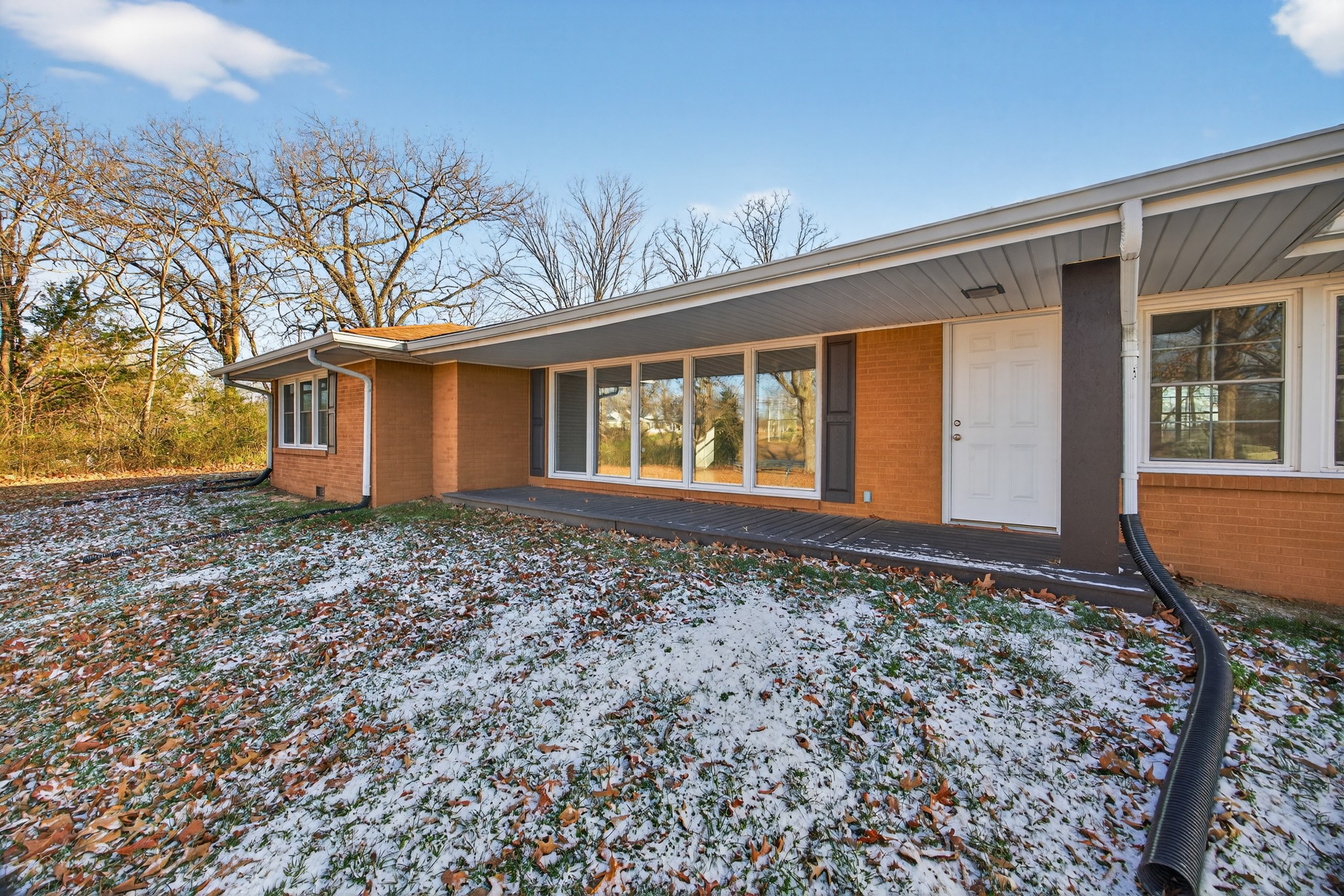2136 West Broad Street Cookeville, TN 38501 - Photo 2 of 33 a front view of a house with garden