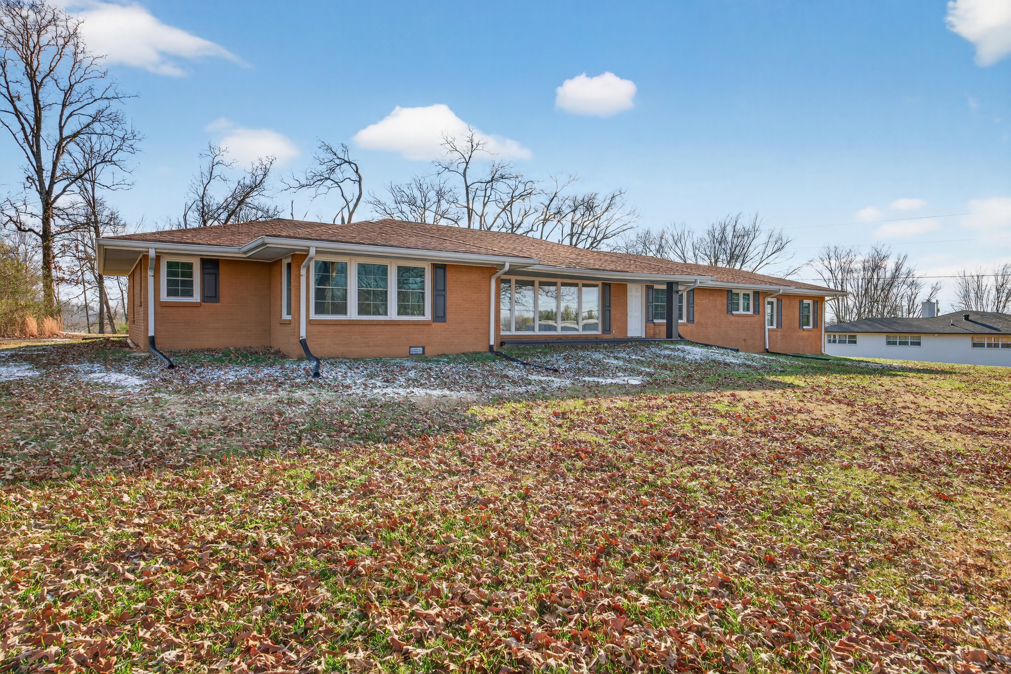 2136 West Broad Street Cookeville, TN 38501 - Photo 25 of 33 a front view of house with yard and trees around