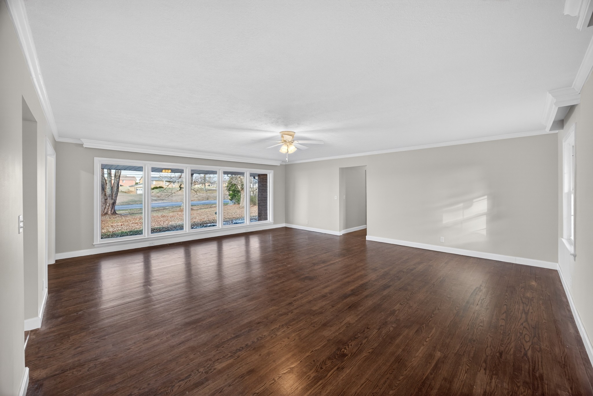 2136 West Broad Street Cookeville, TN 38501 - Photo 6 of 33 a view of empty room with wooden floor and fan