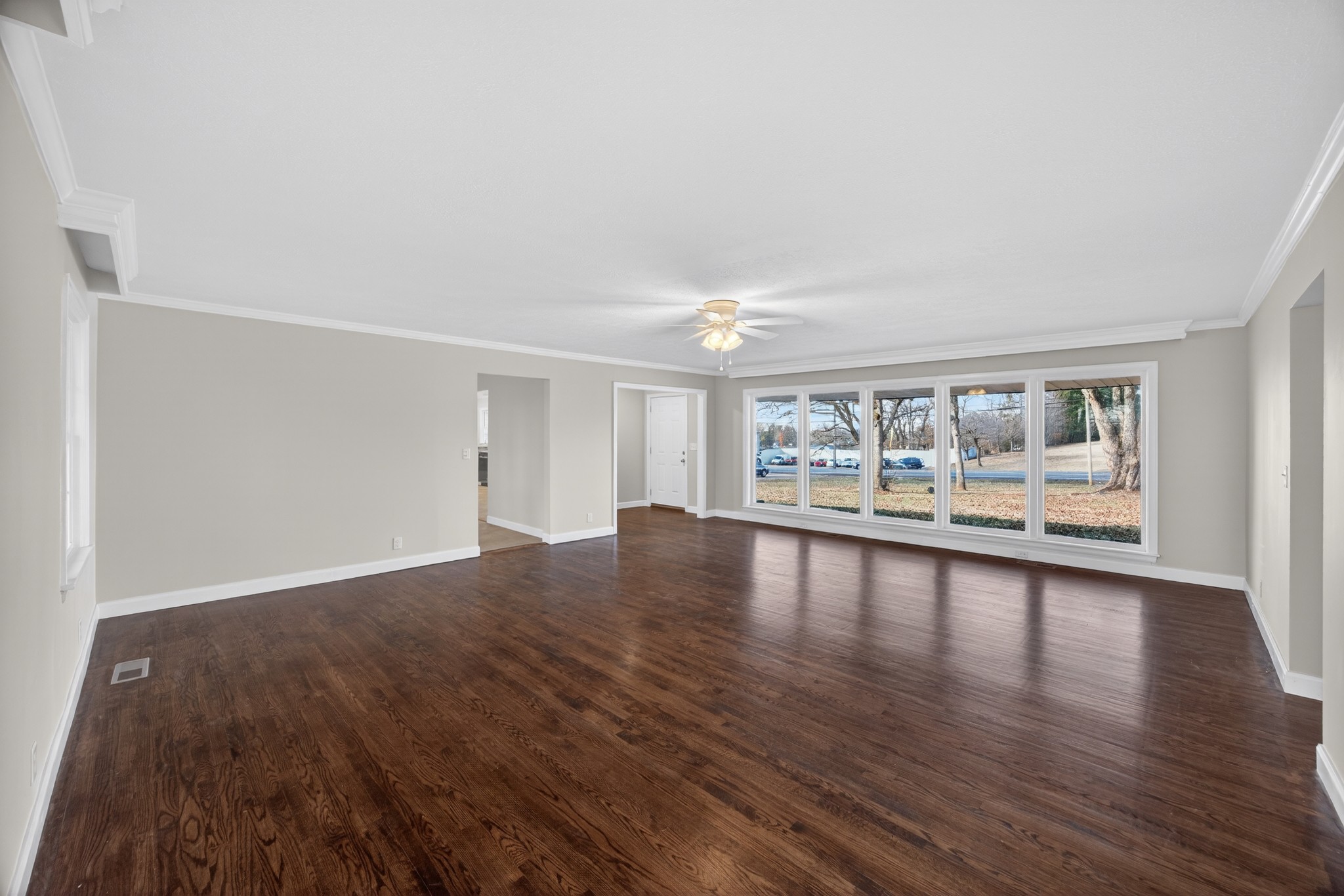2136 West Broad Street Cookeville, TN 38501 - Photo 7 of 33 a view of an empty room with wooden floor and a window