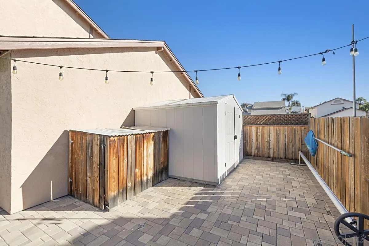 10148 East Glendon Circle Santee, CA 92071 - Photo 28 of 33 a view of a house with a wooden fence