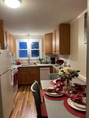 a kitchen with a sink appliances and cabinets