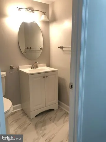 a bathroom with a sink and mirror