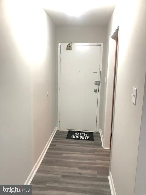 3835 St Barnabas Road, Unit 201 Suitland, MD 20746 - Photo 2 of 12 a view of a hallway with wooden floor