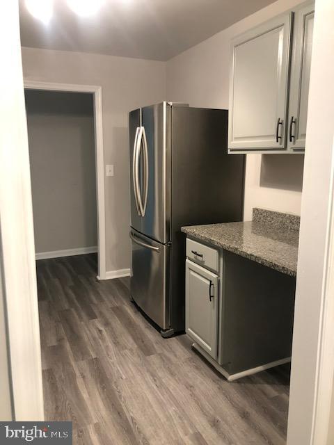 3835 St Barnabas Road, Unit 201 Suitland, MD 20746 - Photo 4 of 12 a kitchen with stainless steel appliances granite countertop a refrigerator and a sink