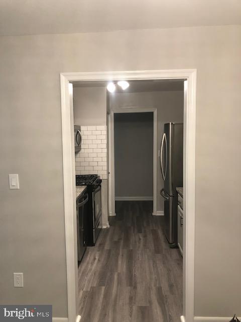 3835 St Barnabas Road, Unit 201 Suitland, MD 20746 - Photo 5 of 12 a view of a kitchen from a hallway