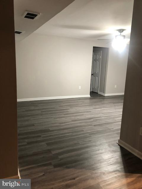 3835 St Barnabas Road, Unit 201 Suitland, MD 20746 - Photo 7 of 12 a view of an empty room with wooden floor
