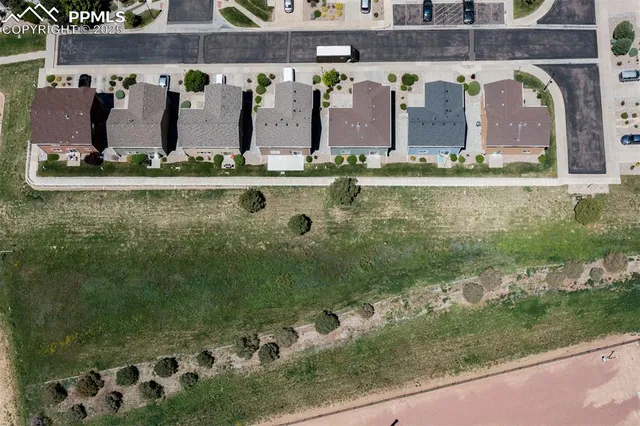 a view of a room with a ceiling fan