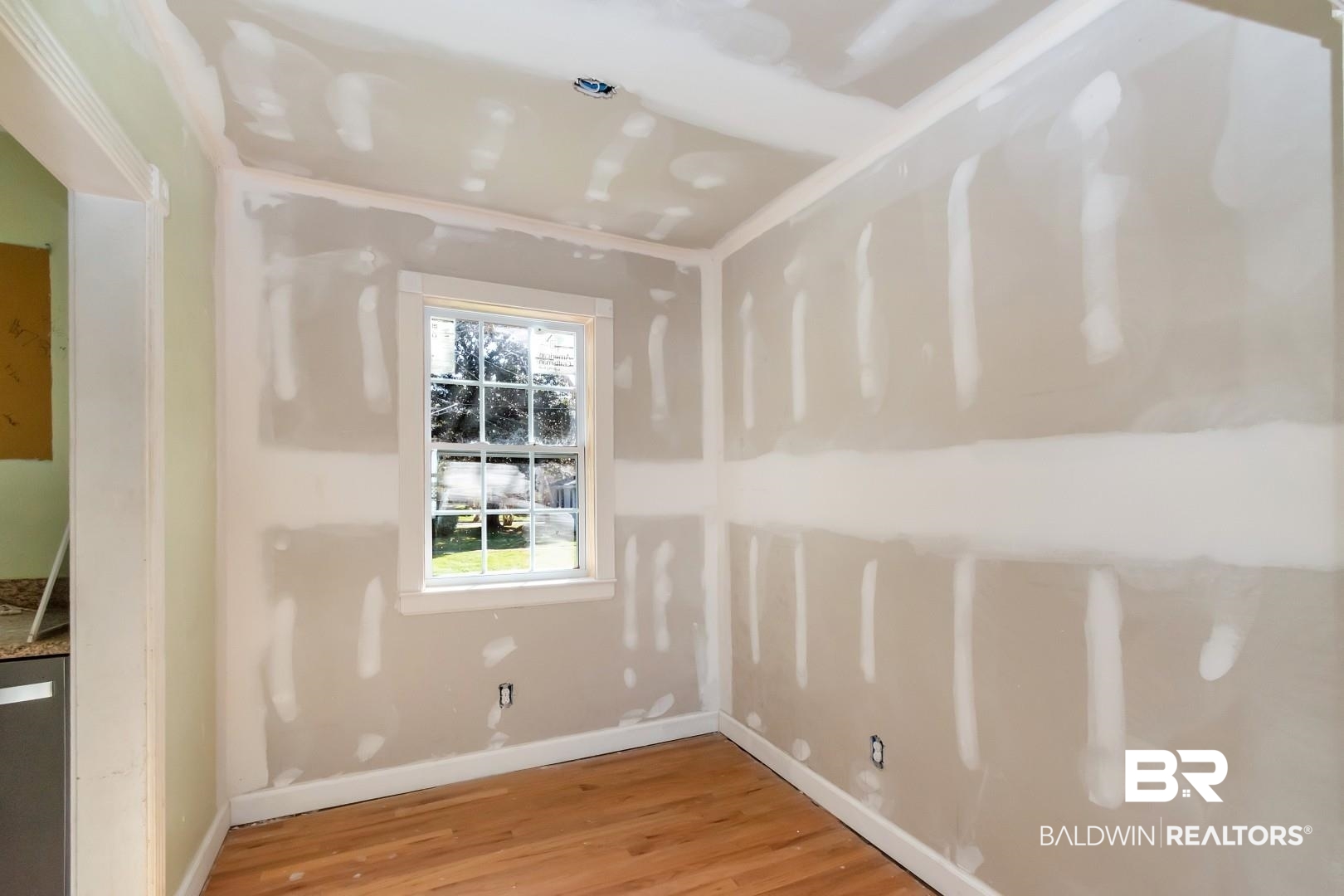 214 Upham Street, Unit 4A Mobile, AL 36607 - Photo 17 of 23 Unfurnished room featuring baseboards and light wood-type flooring
