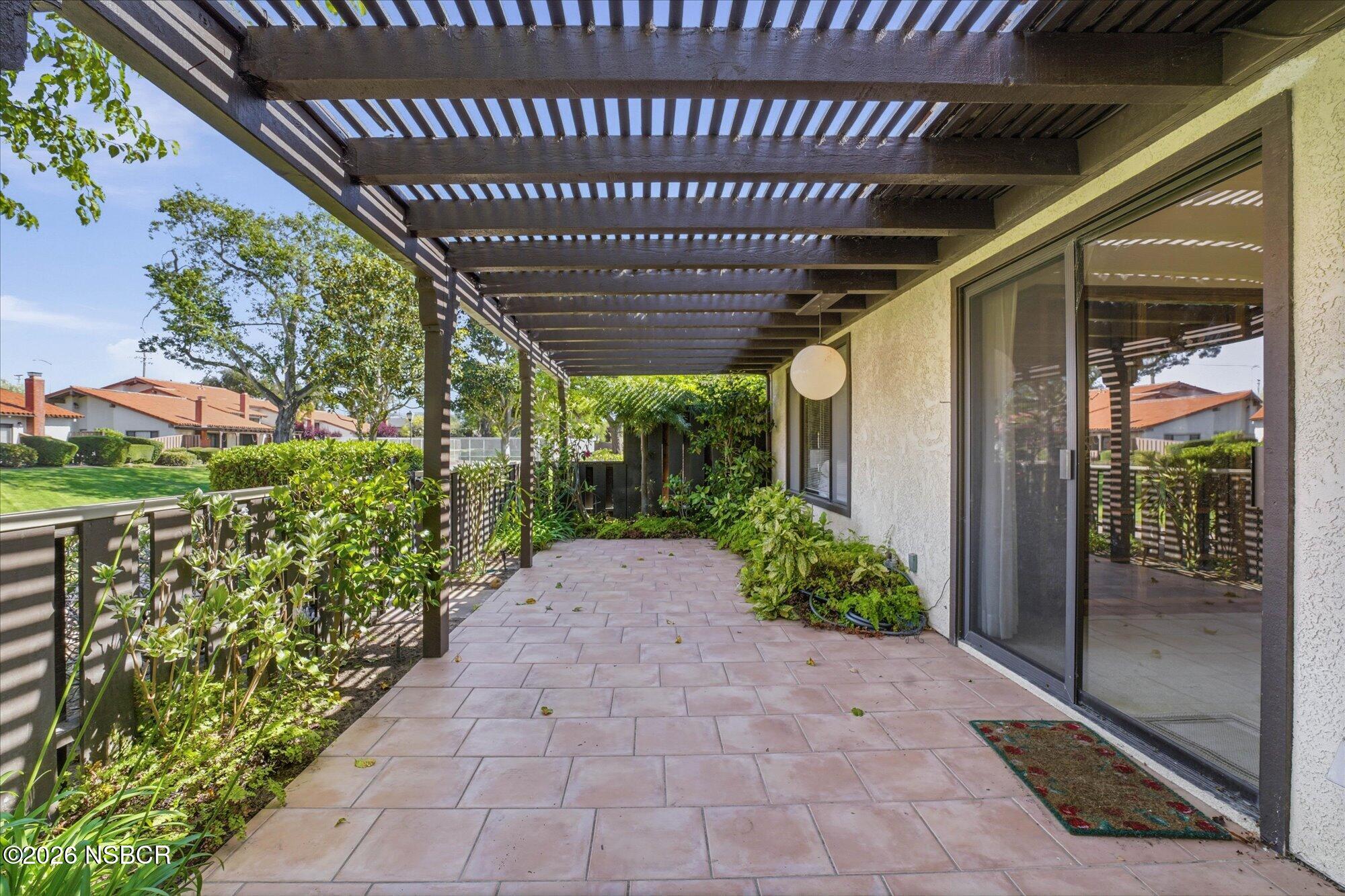 166 Tallyho Road Santa Maria, CA 93455 - Photo 18 of 20 a view of a porch with a table and chairs