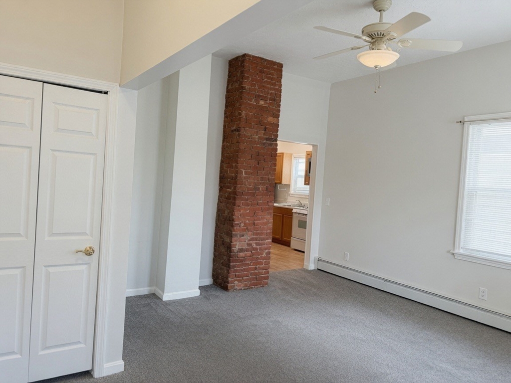 37 Madison Street, Unit 37 Malden, MA 02148 - Photo 9 of 10 wooden floor in an empty room with a window