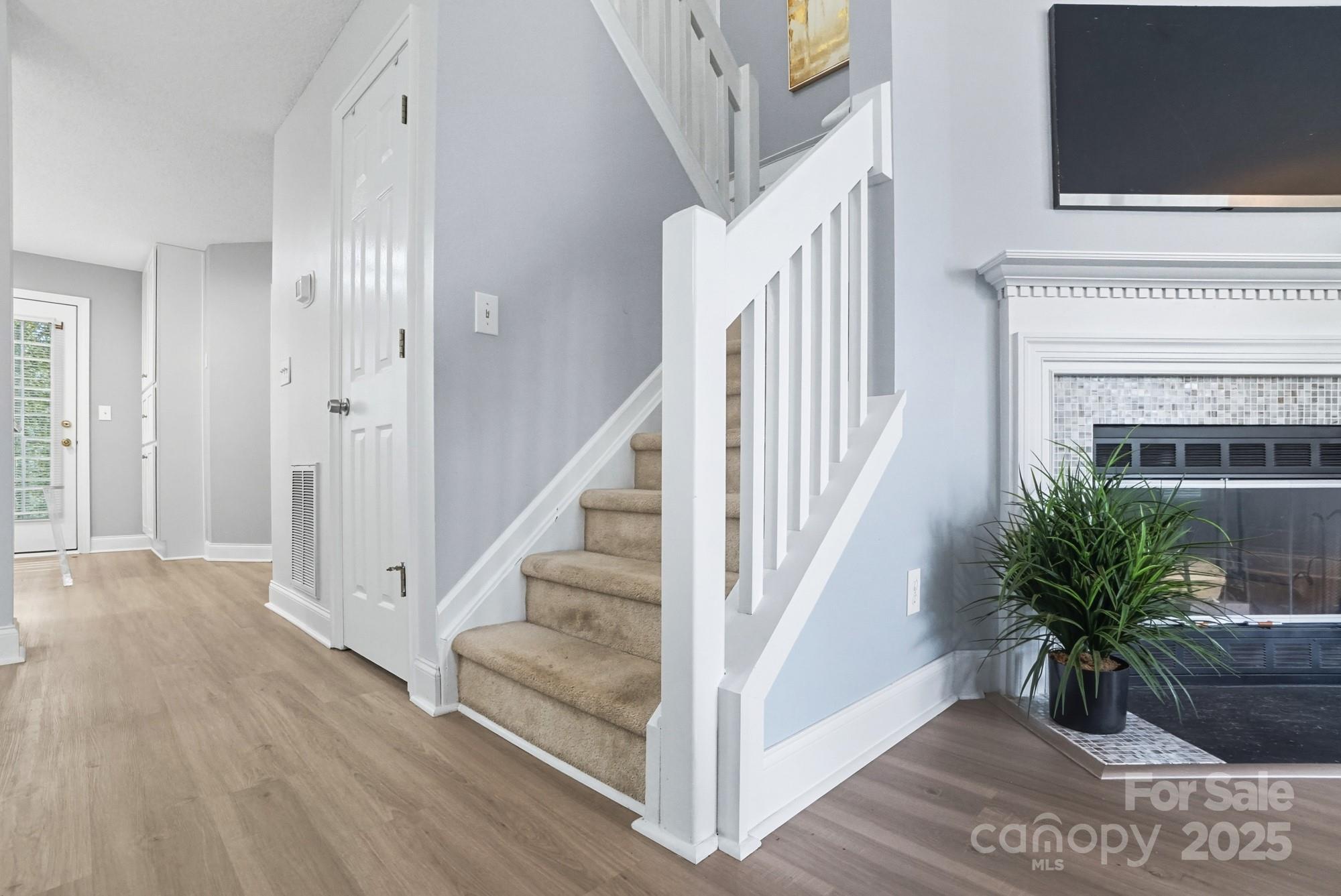 9166 Exbury Court Charlotte, NC 28269 - Photo 18 of 31 a view of front door with stairs