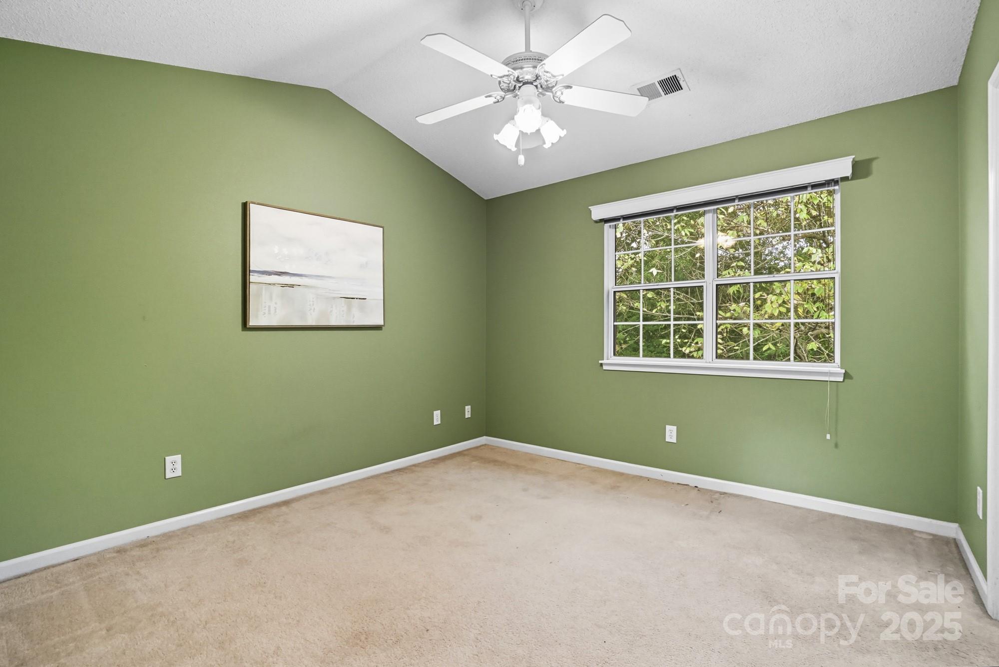 9166 Exbury Court Charlotte, NC 28269 - Photo 24 of 31 a view of room with window and ceiling fan