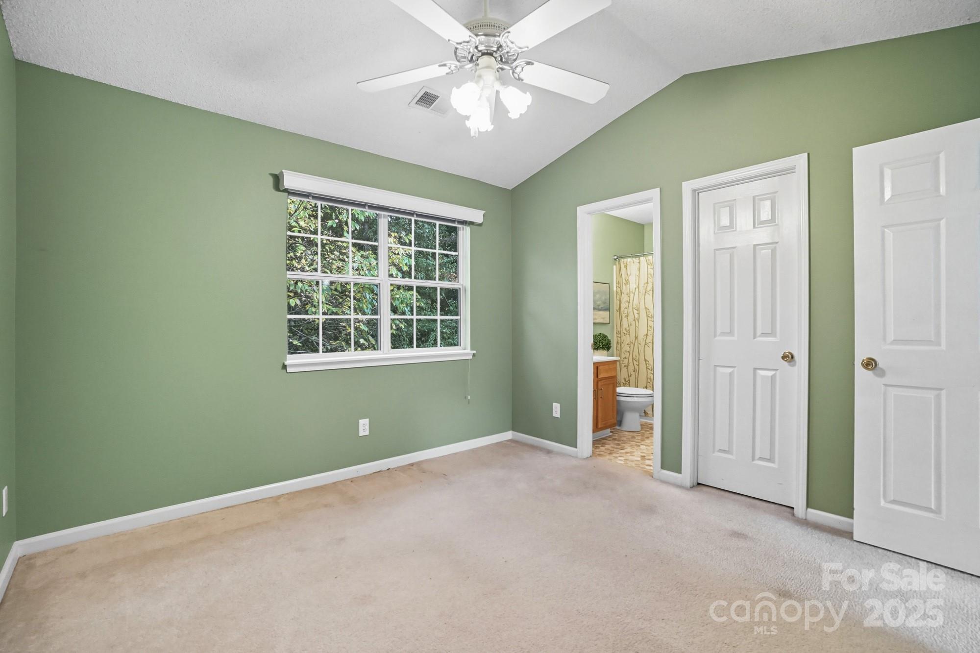 9166 Exbury Court Charlotte, NC 28269 - Photo 26 of 31 a view of an empty room with window and closet area