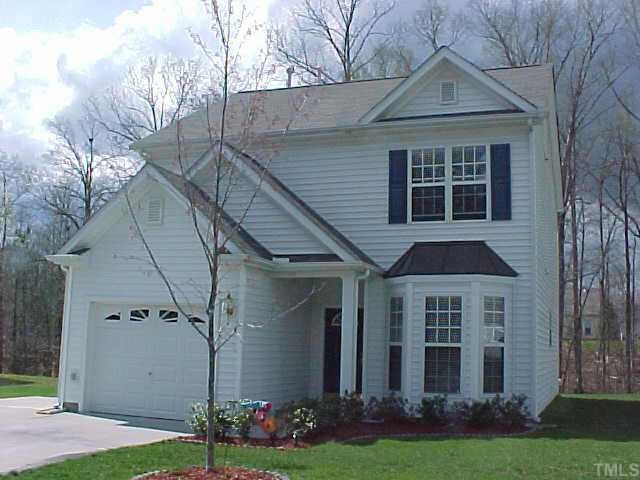 Front view of the house showing its great curb appeal with landscaped yard and bay window Exterior Front