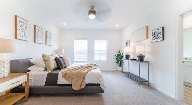 a bed room with a bed and a couch