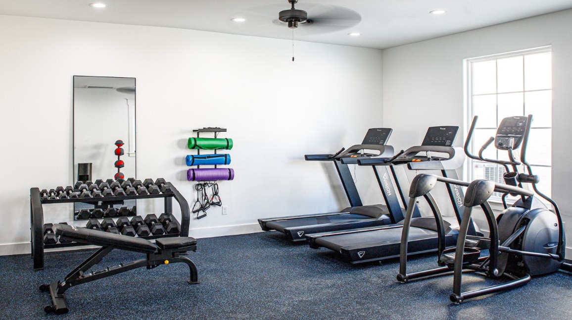 9910 Kilkenny Street Rosharon, TX 77583 - Photo 6 of 10 a room with gym equipment and windows