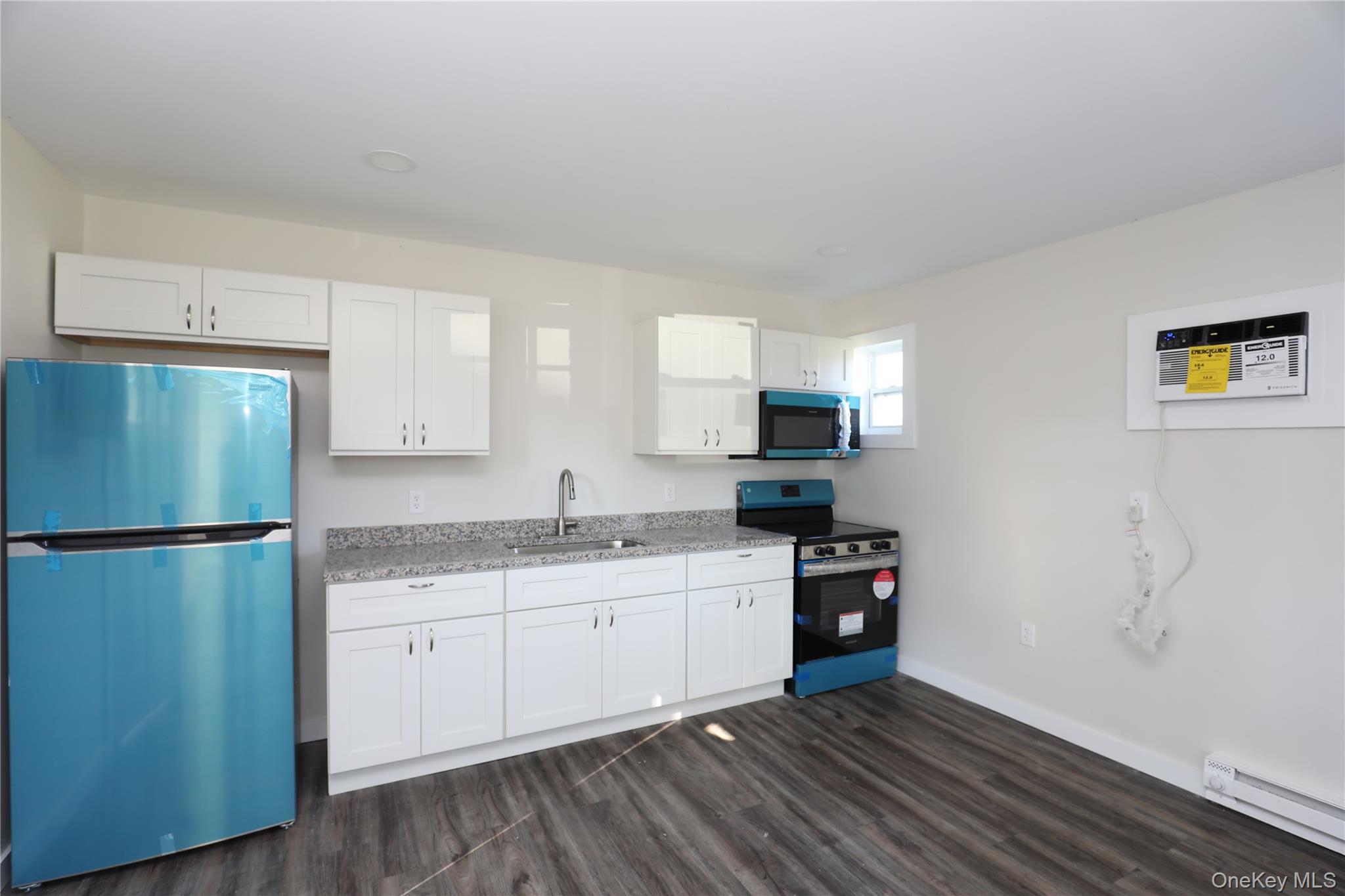 14311 Rte 9W, Unit 2 Ravena, NY 12143 - Photo 2 of 9 a kitchen with a refrigerator and a sink