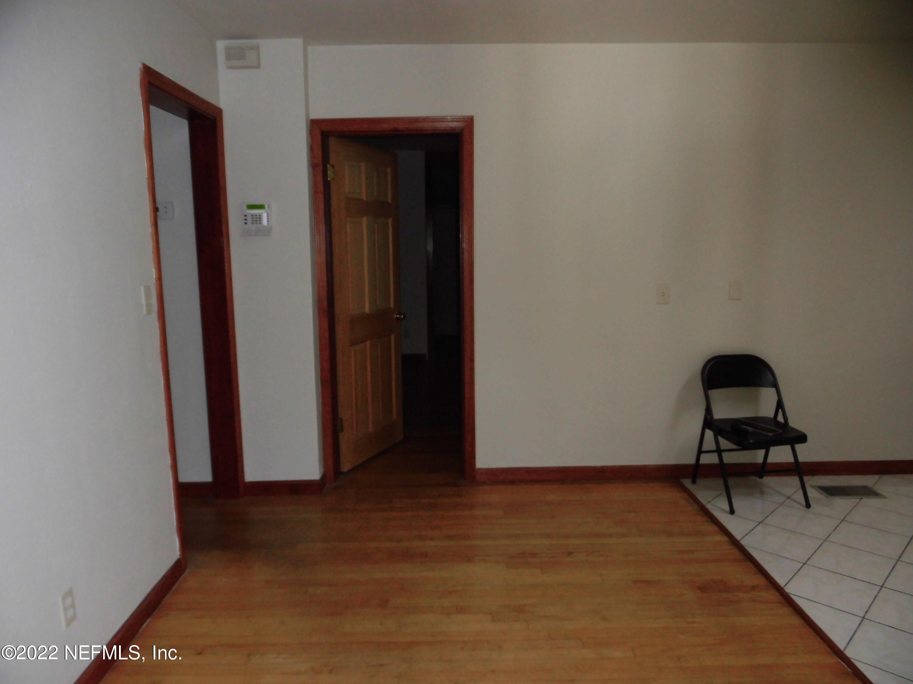1750 Rogero Road Jacksonville, FL 32211 - Photo 13 of 35 a view of a livingroom with wooden floor and closet