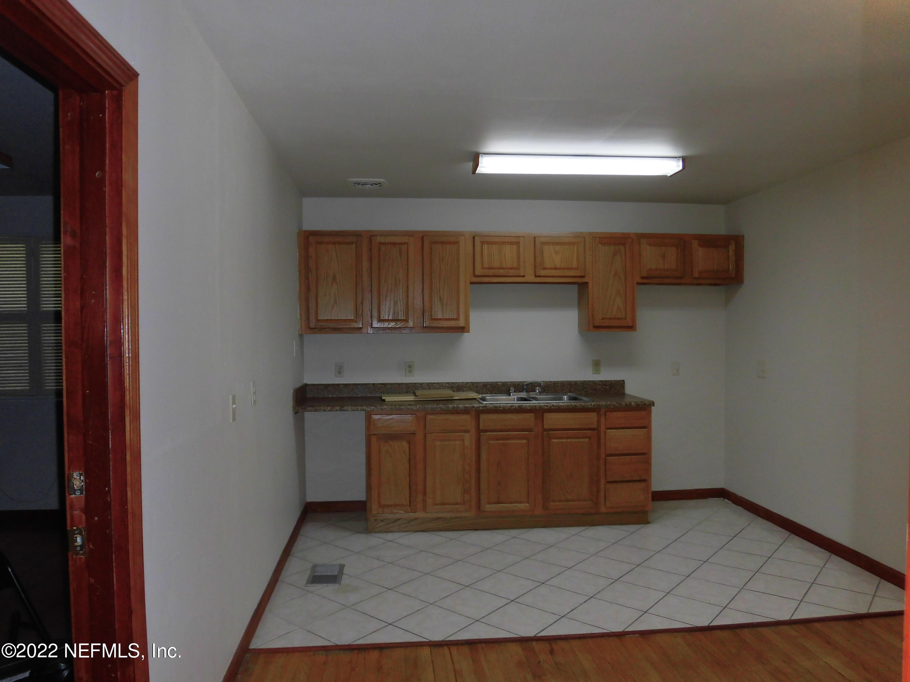 1750 Rogero Road Jacksonville, FL 32211 - Photo 26 of 35 a kitchen with stainless steel appliances granite countertop a stove a sink and a refrigerator
