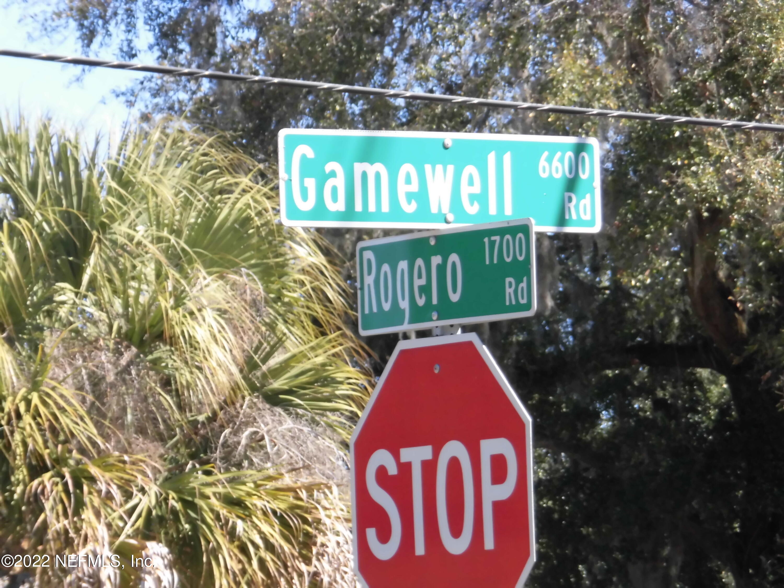 1750 Rogero Road Jacksonville, FL 32211 - Photo 35 of 35 a sign broad on the side of the road