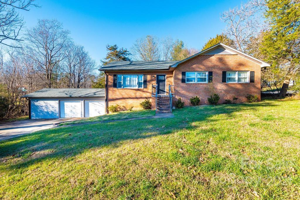 5196 Jenkins Road Morganton, NC 28655 - Photo 1 of 46 a front view of a house with a yard