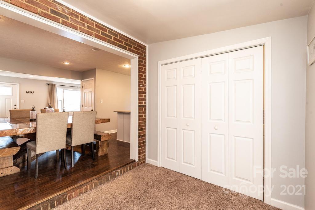 5196 Jenkins Road Morganton, NC 28655 - Photo 22 of 46 a view of a a dining room with furniture window and wooden floor
