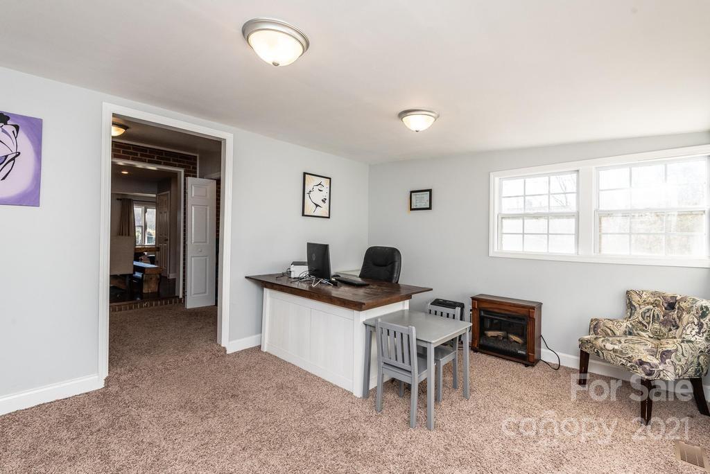 5196 Jenkins Road Morganton, NC 28655 - Photo 24 of 46 a view of a workspace with furniture and a window