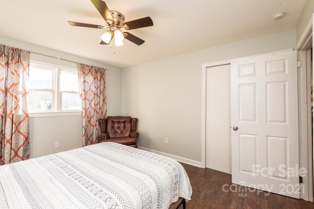 5196 Jenkins Road Morganton, NC 28655 - Photo 25 of 46 a bedroom with a bed and a window