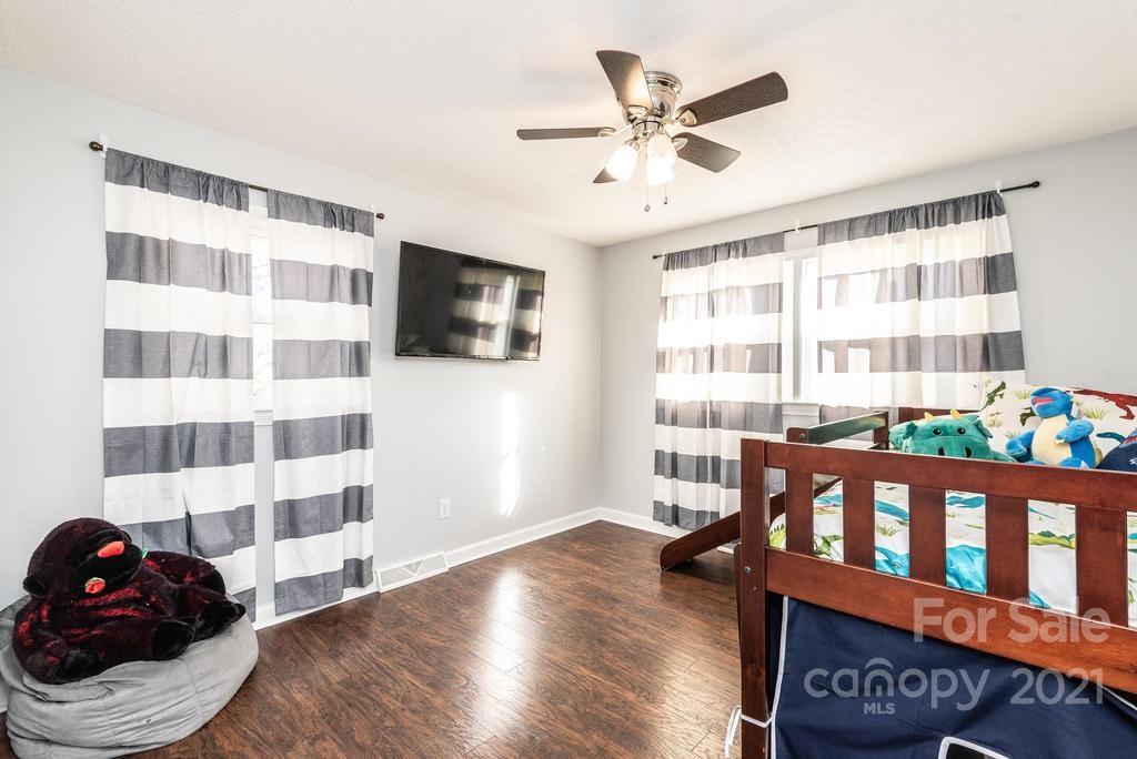 5196 Jenkins Road Morganton, NC 28655 - Photo 29 of 46 a view of a bedroom with wooden floor and windows