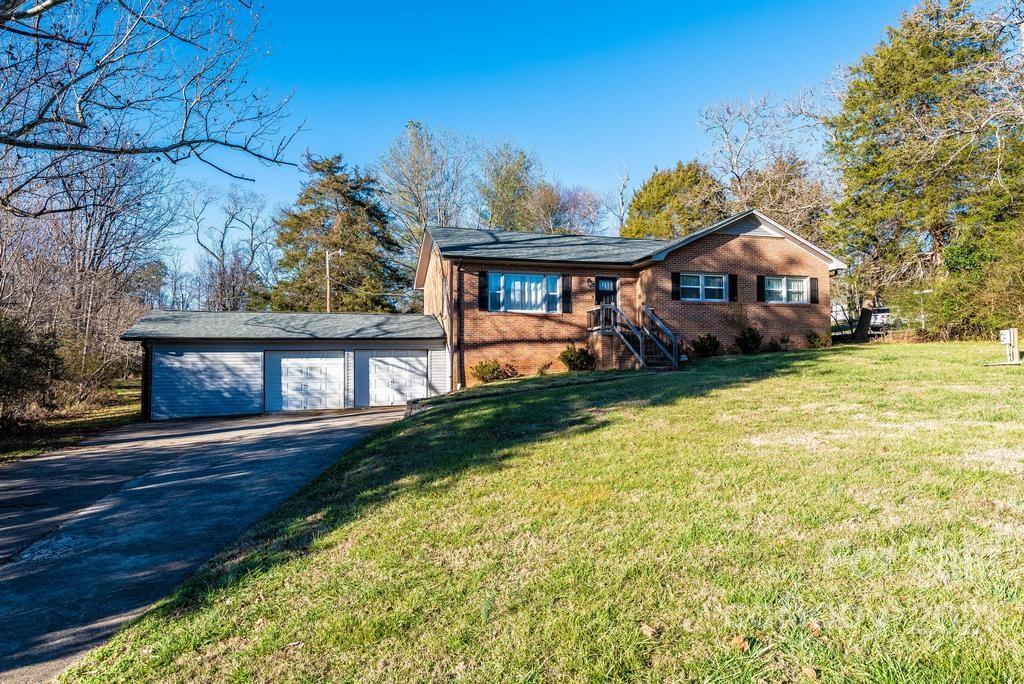 5196 Jenkins Road Morganton, NC 28655 - Photo 3 of 46 a front view of a house with a yard